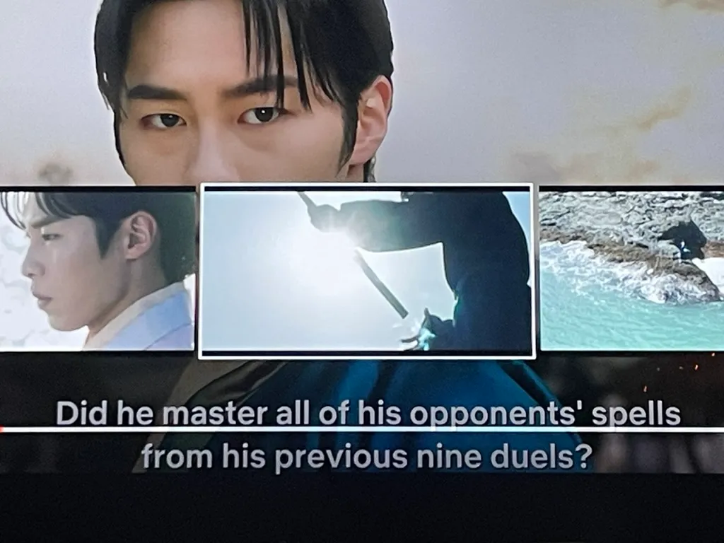 A screenshot of a still from a movie. The subtitling reads: &#x27;Did he master all of his opponents&#x27; spells from his previous nine duels?&#x27;